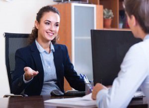 Female business professional speaking with coworker
