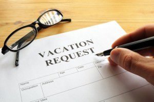Someone filling out a vacation request form